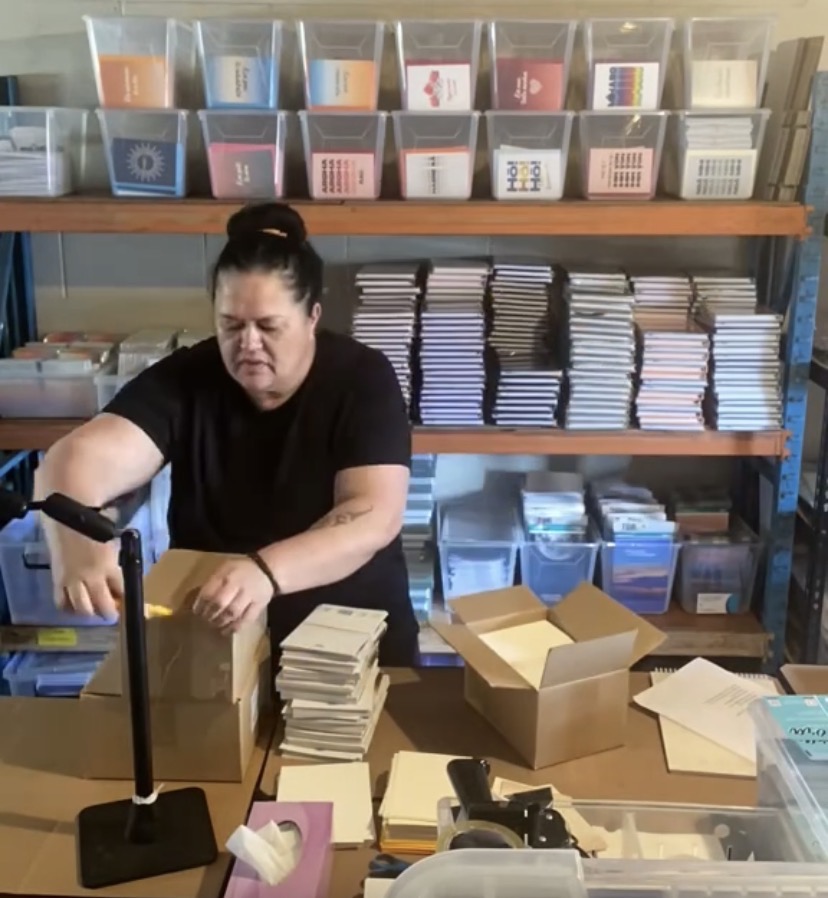 Geneva Harrison working in the Tuhi Stationery warehouse